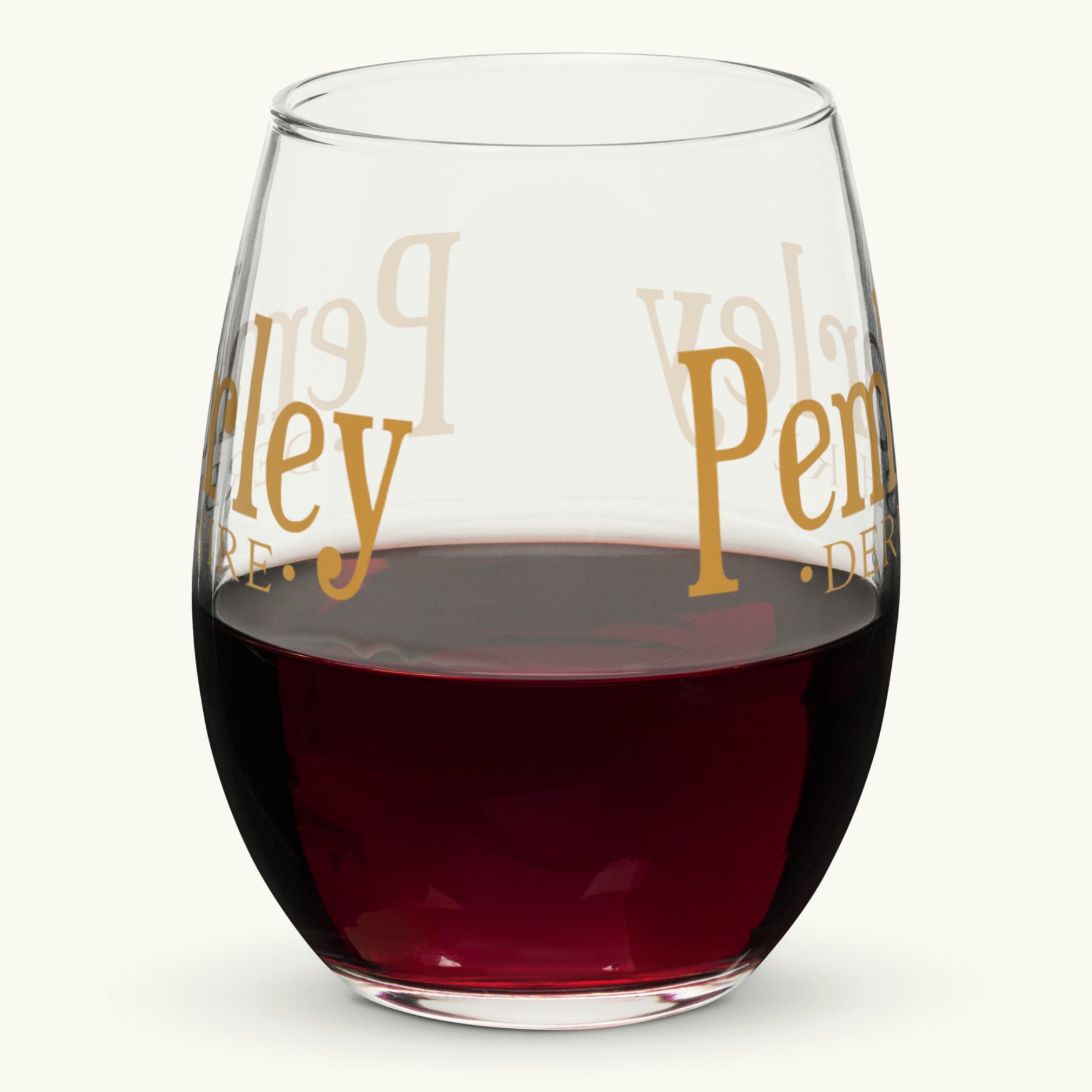 Pemberley Stemless Wine Glass half filled with red wine. Jane Austen Pride and Prejudice